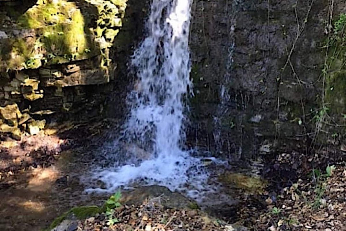 Wet-weather waterfall on the property, running after heavy Ozark rains