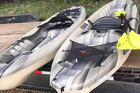 The two single kayaks provided for guests, ready to launch on the James River