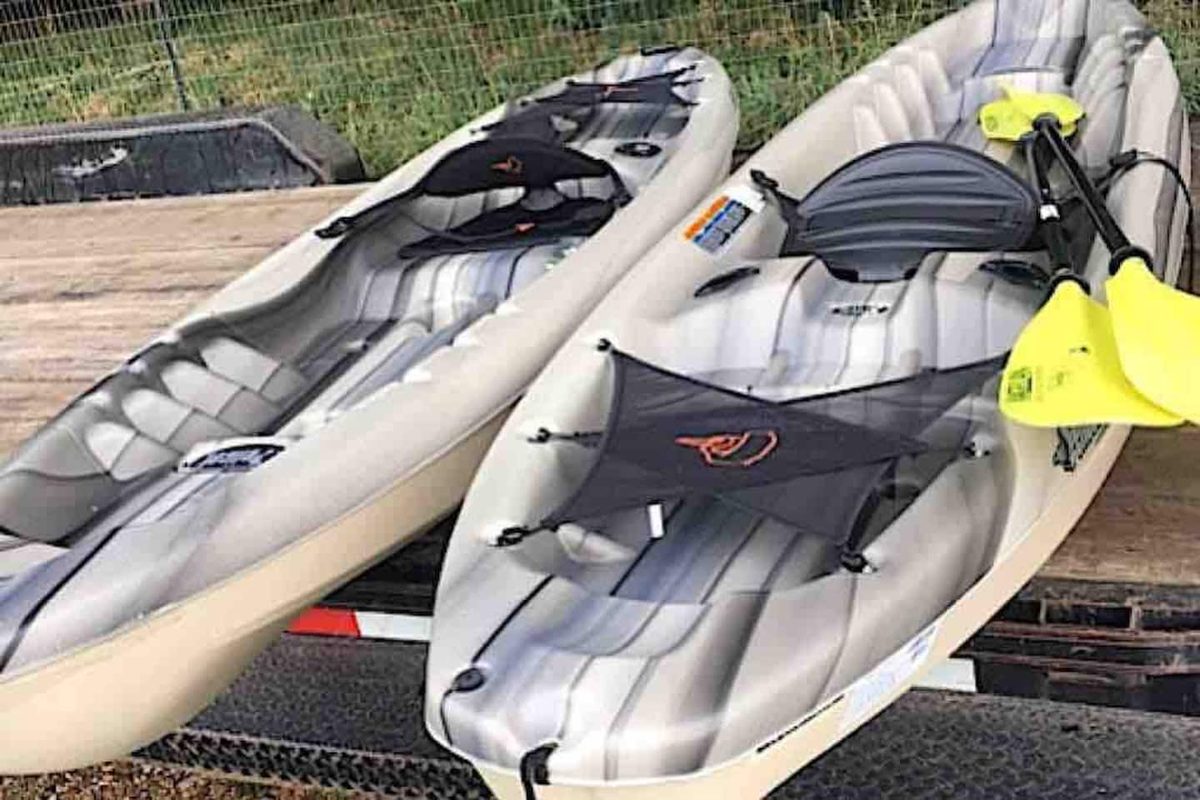 The two single kayaks provided for guests, ready to launch on the James River