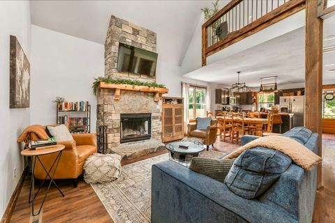 Living room sofa that converts to a sleeper bed, adding flexible sleeping space at the cabin
