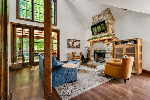 Open-plan living space with rustic-modern decor and warm wood floors