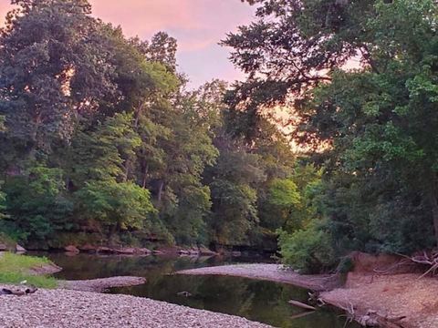 The James River at dusk from the property’s private gravel bank — levels fluctuate year-round