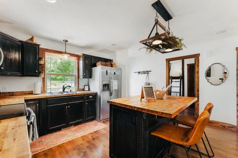 Cabin kitchen counter with prep space and pantry staples provided for guests