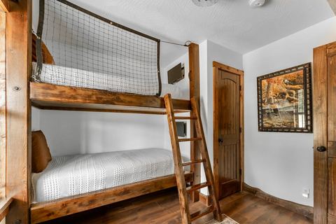 Bunk room detail with fresh linens, ready for kids at the cabin
